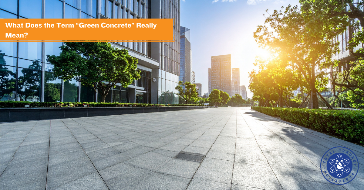 Modern green building and paved concrete walkway representing sustainable concrete construction and green concrete principles.